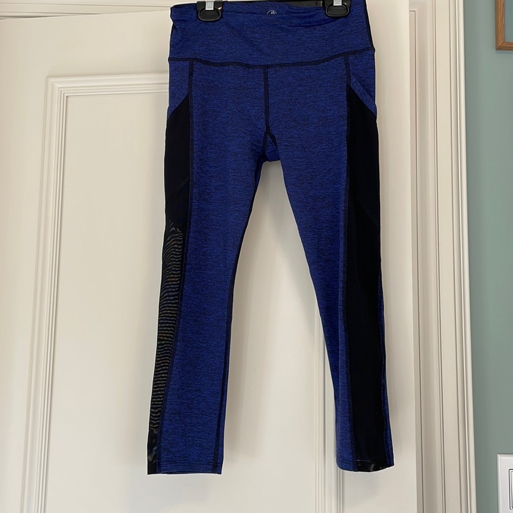 Blue 3/4 body glove leggings with mesh side panels and pockets